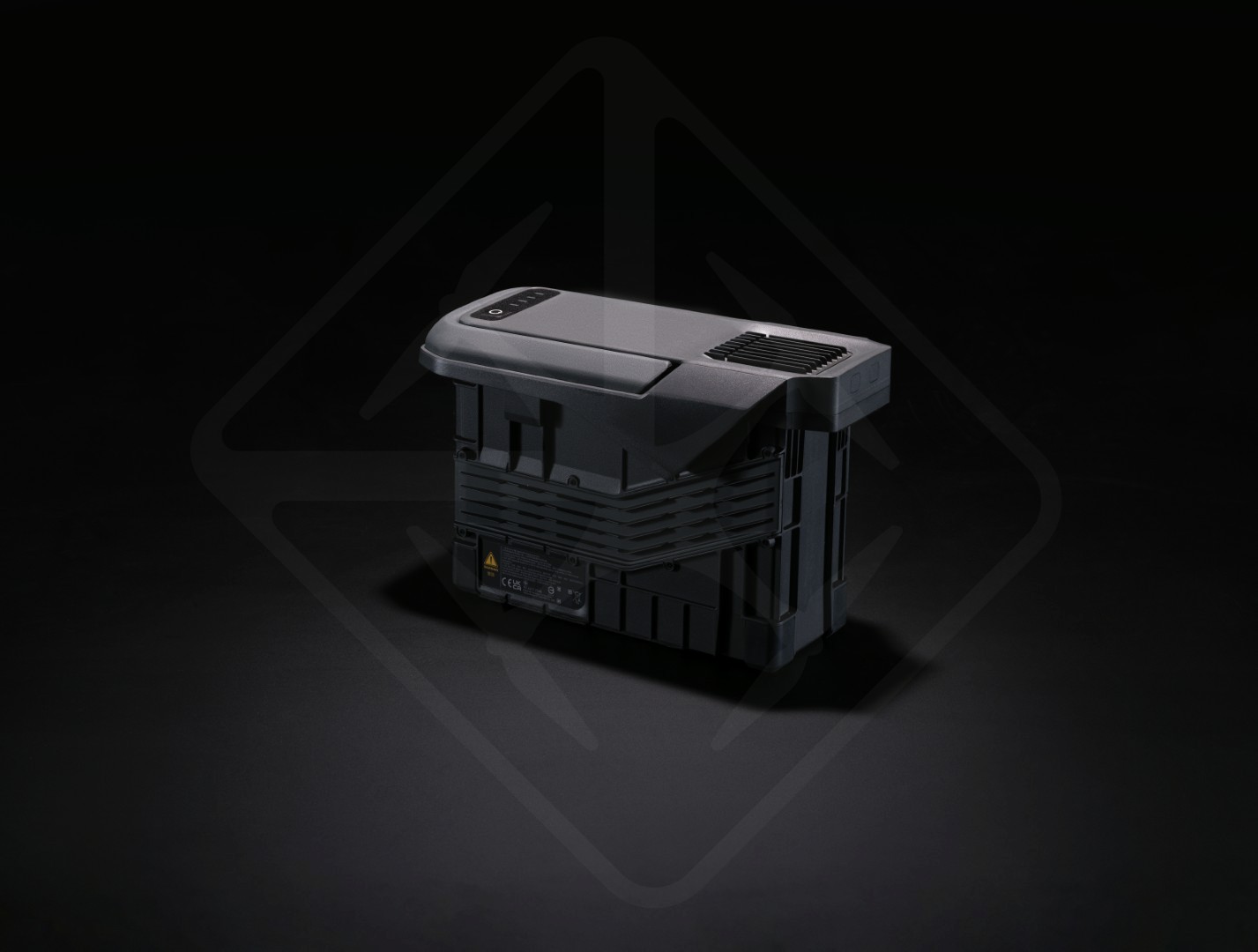 Batterie de drone grise sur fond noir.