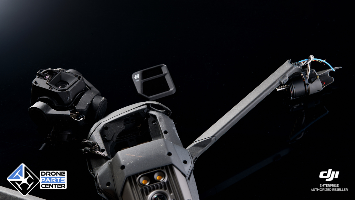 Drone spare parts on black background.