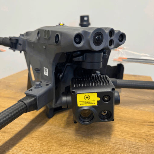 Technological drone on wooden table.