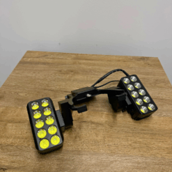 Black LED light on wooden table.