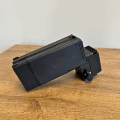 Black spotlight on wooden table.