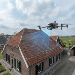 Drone analyzing the roof of a traditional house.