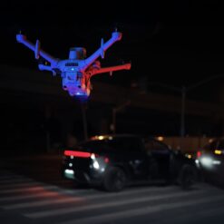 DJI Matrice 5TD at night with red and blue warning lights